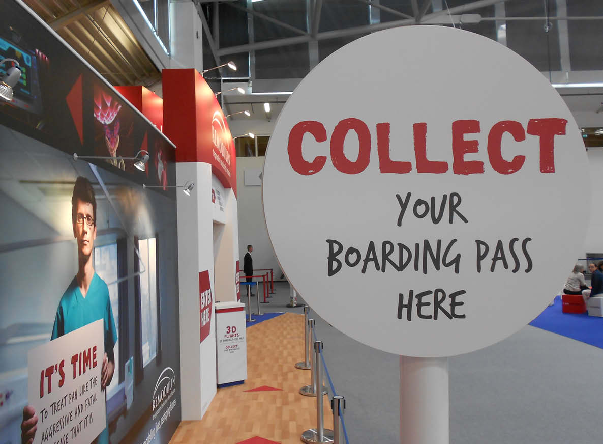 Exhibition booth sign - collect your boarding pass here